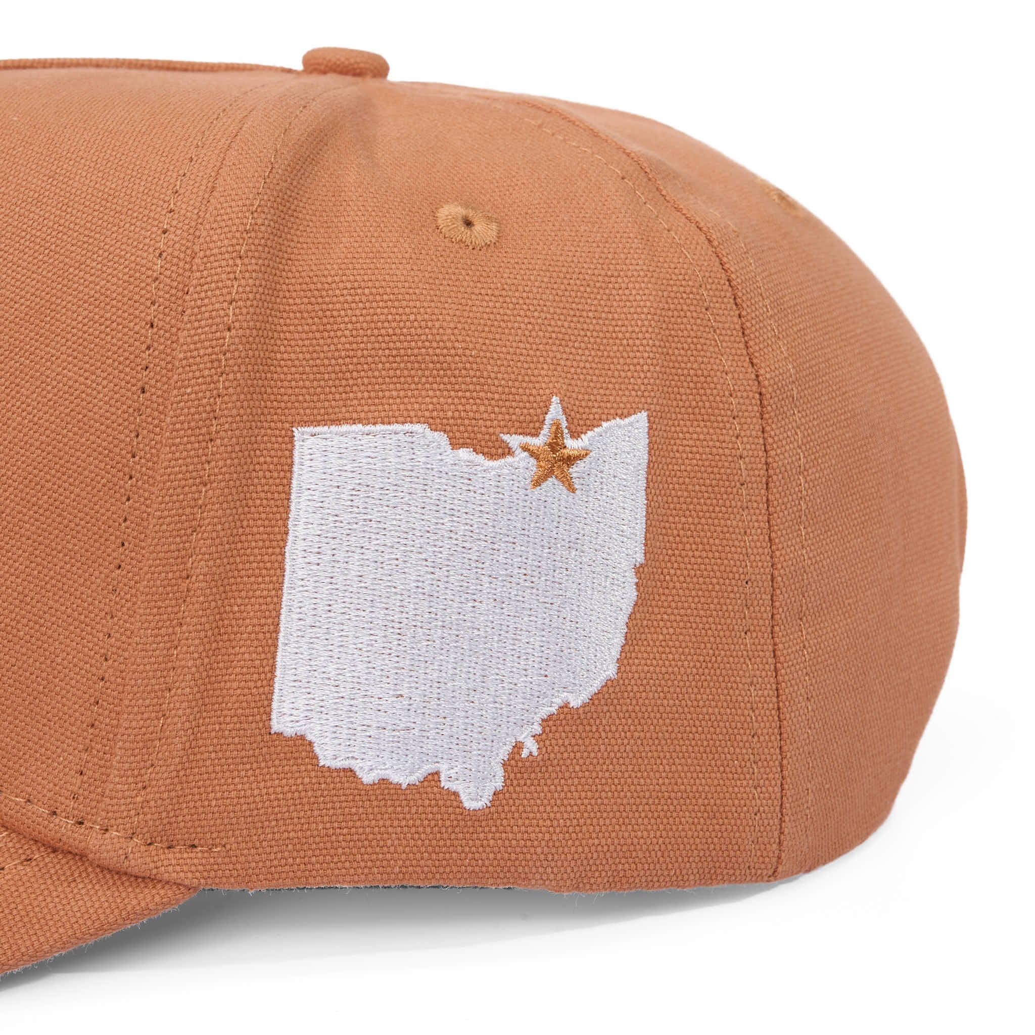 Brown cap with white state of ohio outline and star design on a white background