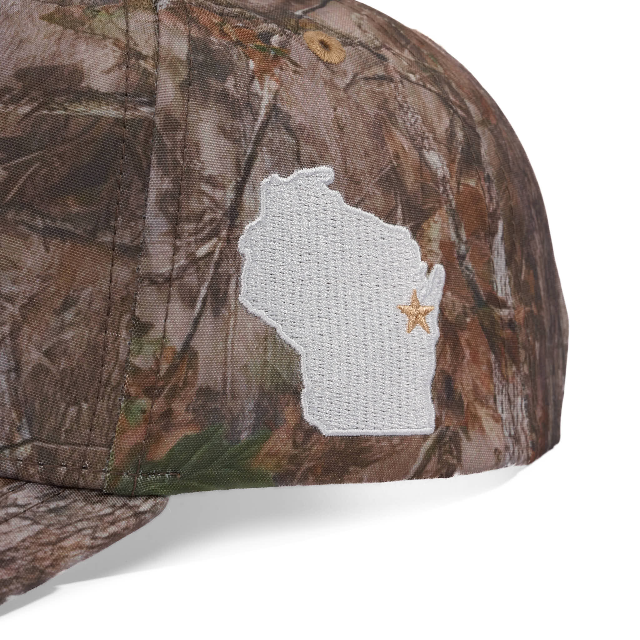 Camouflage cap with a white embroidered design of a state and star on a white background