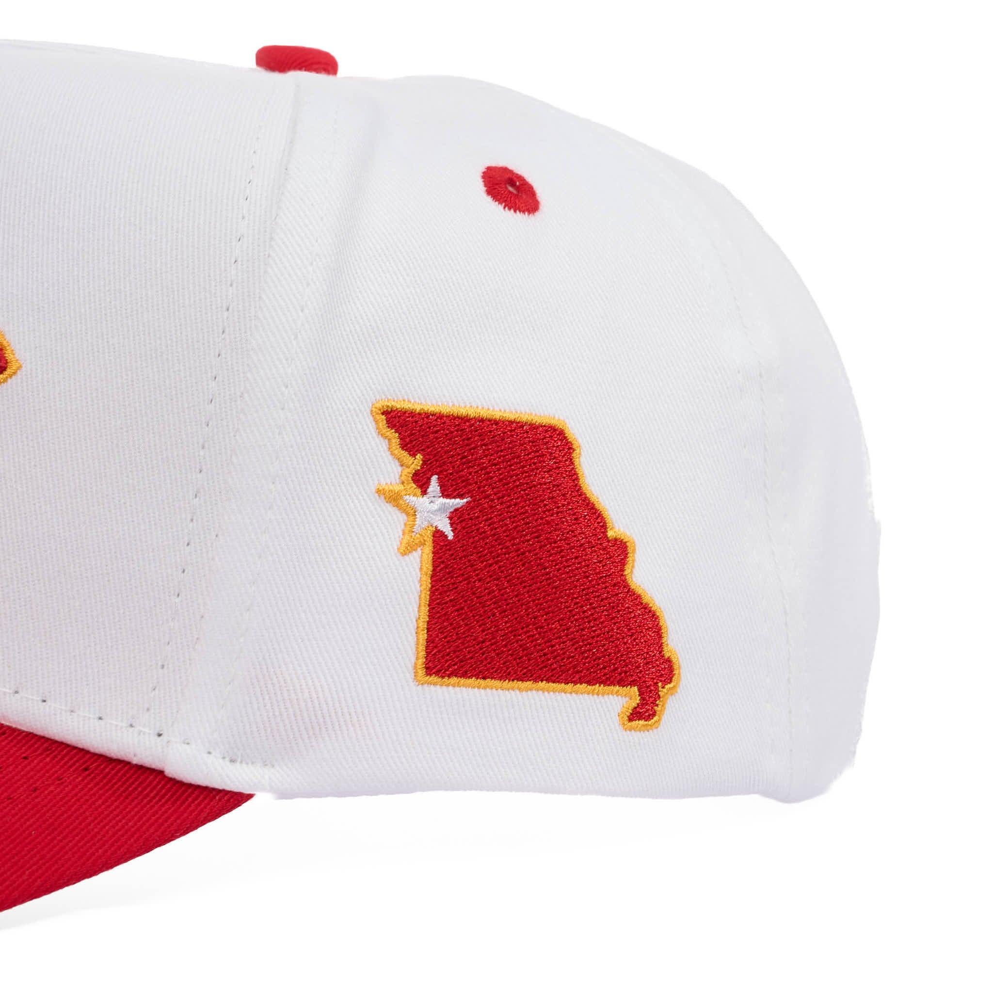 White and red cap with a red and yellow map design on a white background