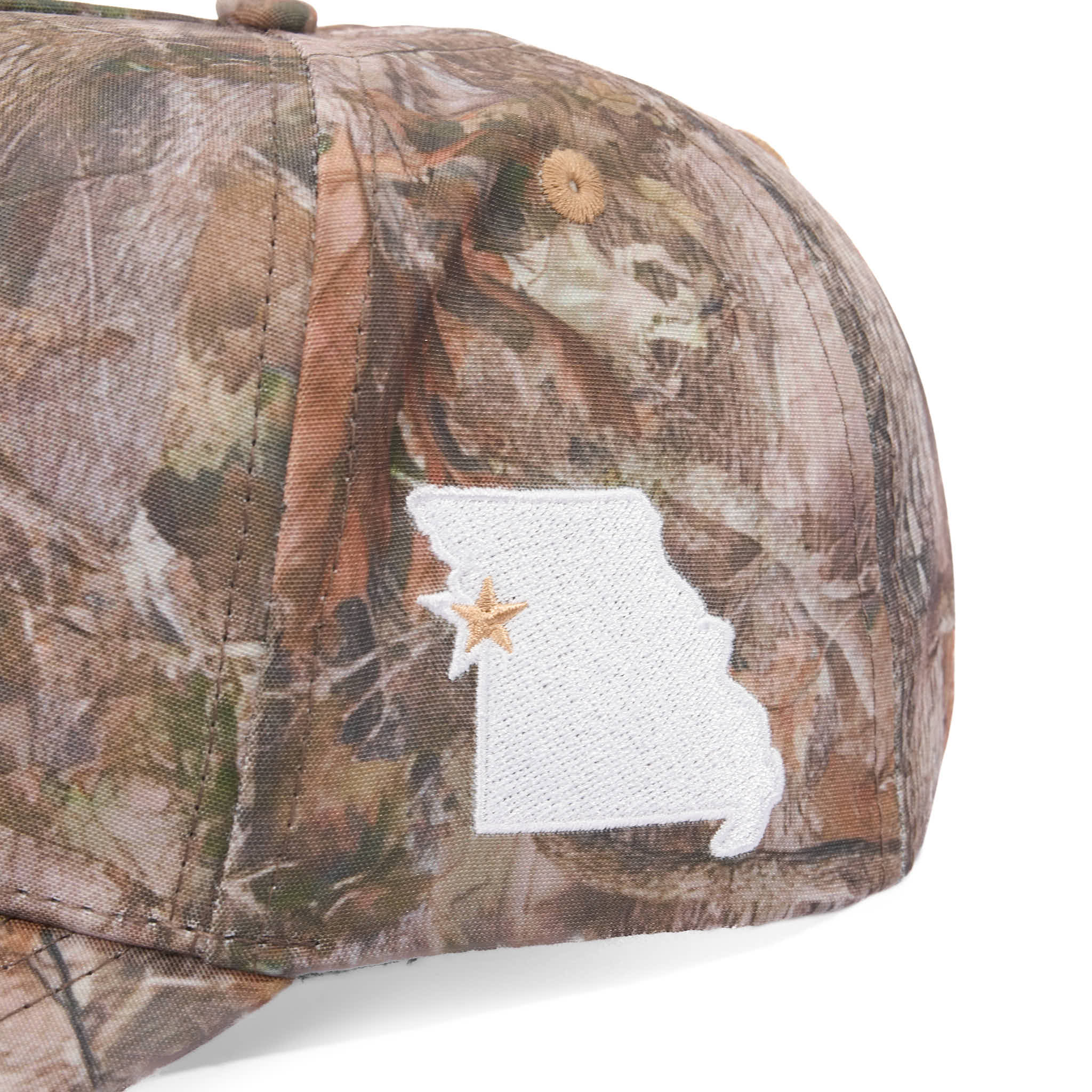 Camouflage cap with a white patch featuring a star and a state outline on a white background