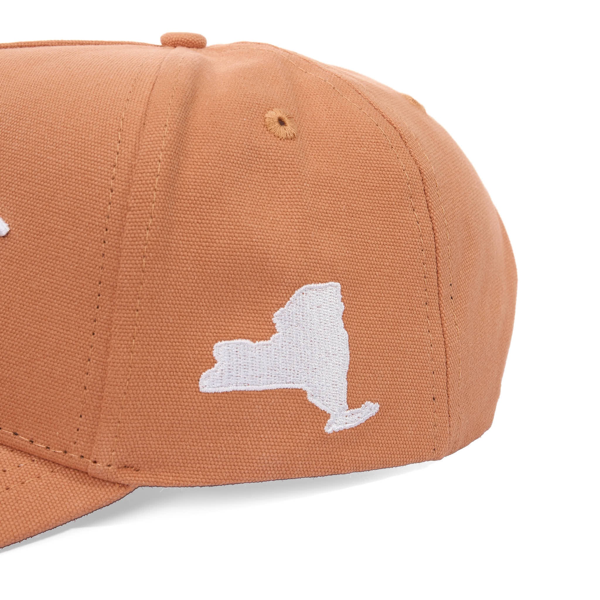 Brown cap with white outline of New York state on a white background