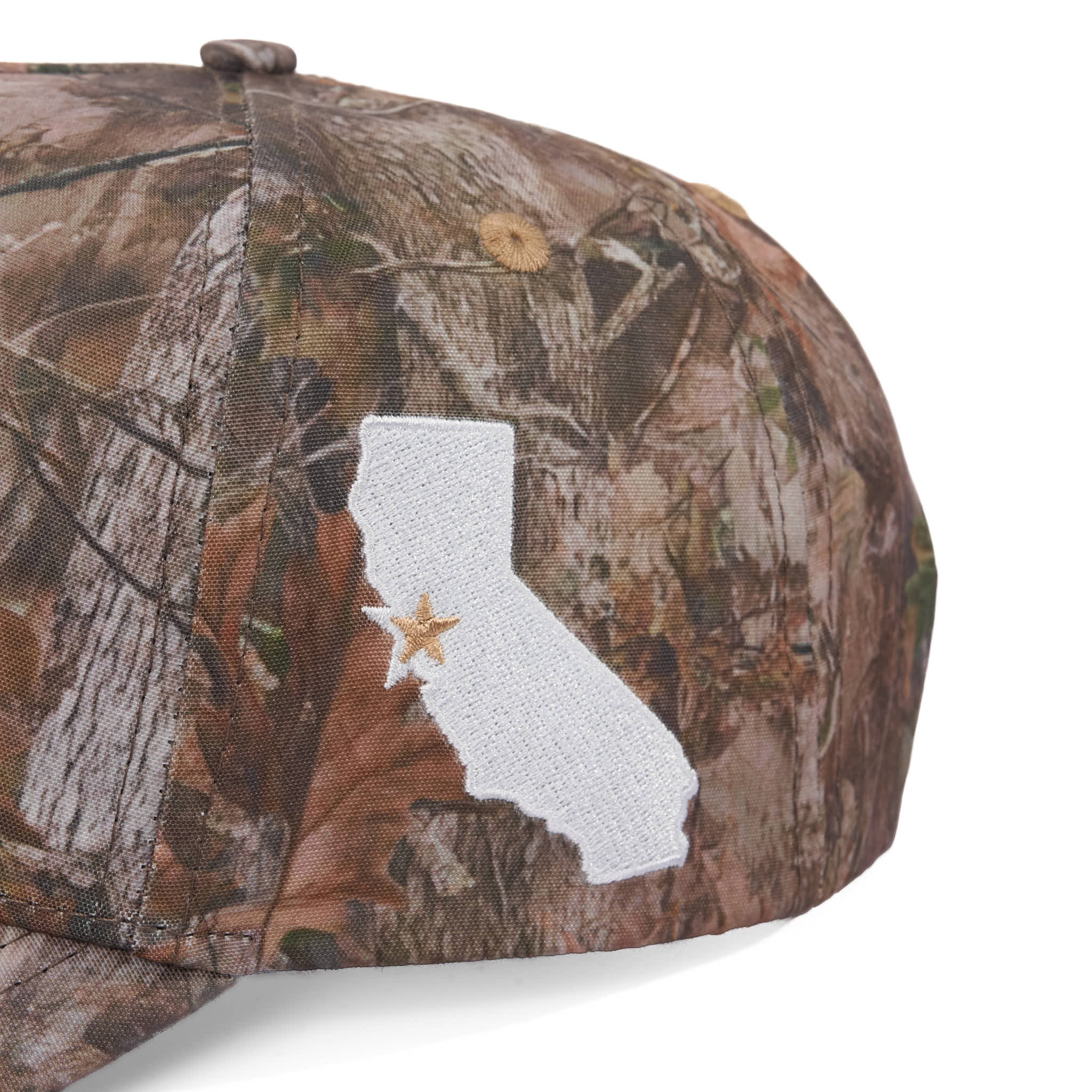 Camouflage cap with a white state outline and star on a white background