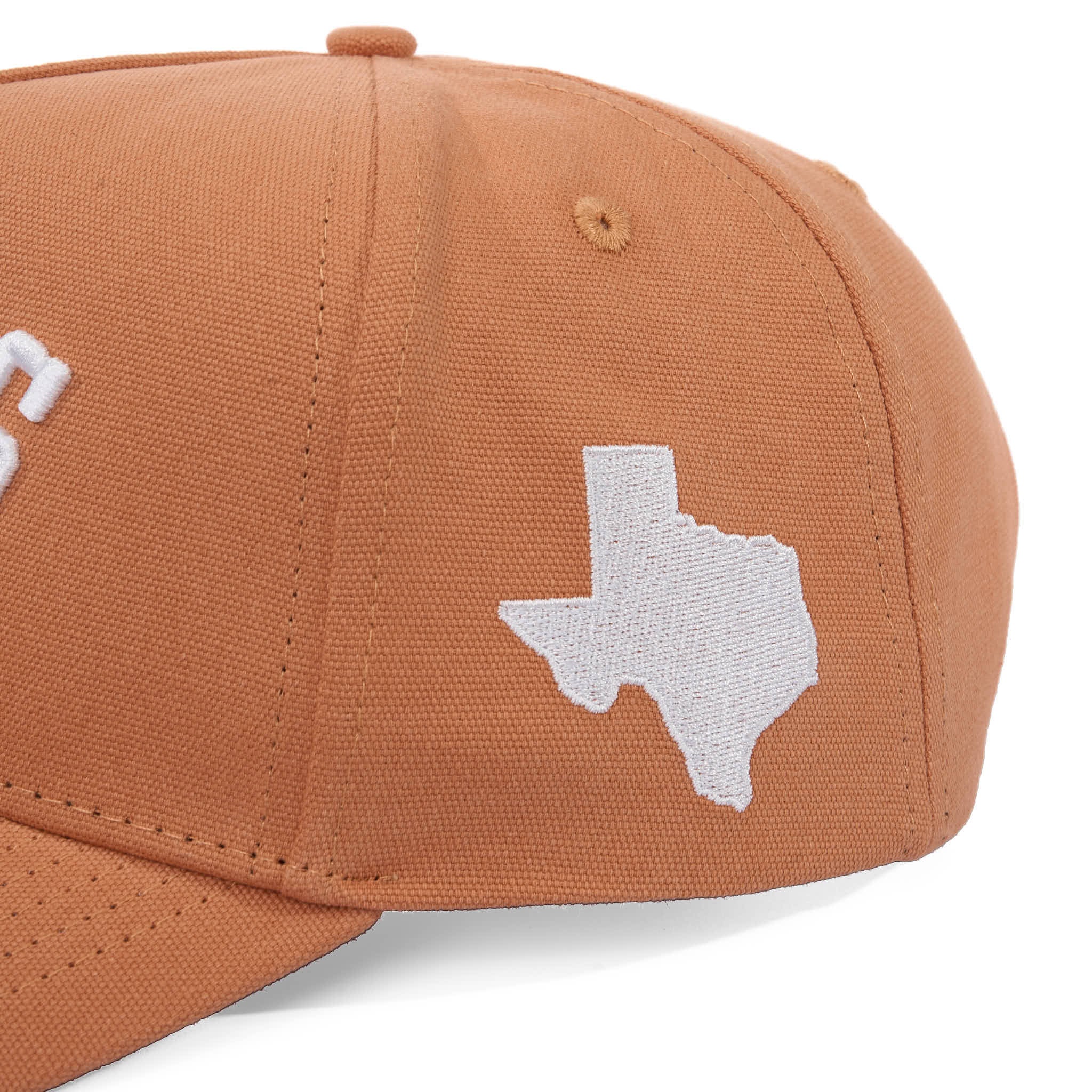 Brown cap with white Texas shape logo on a white background