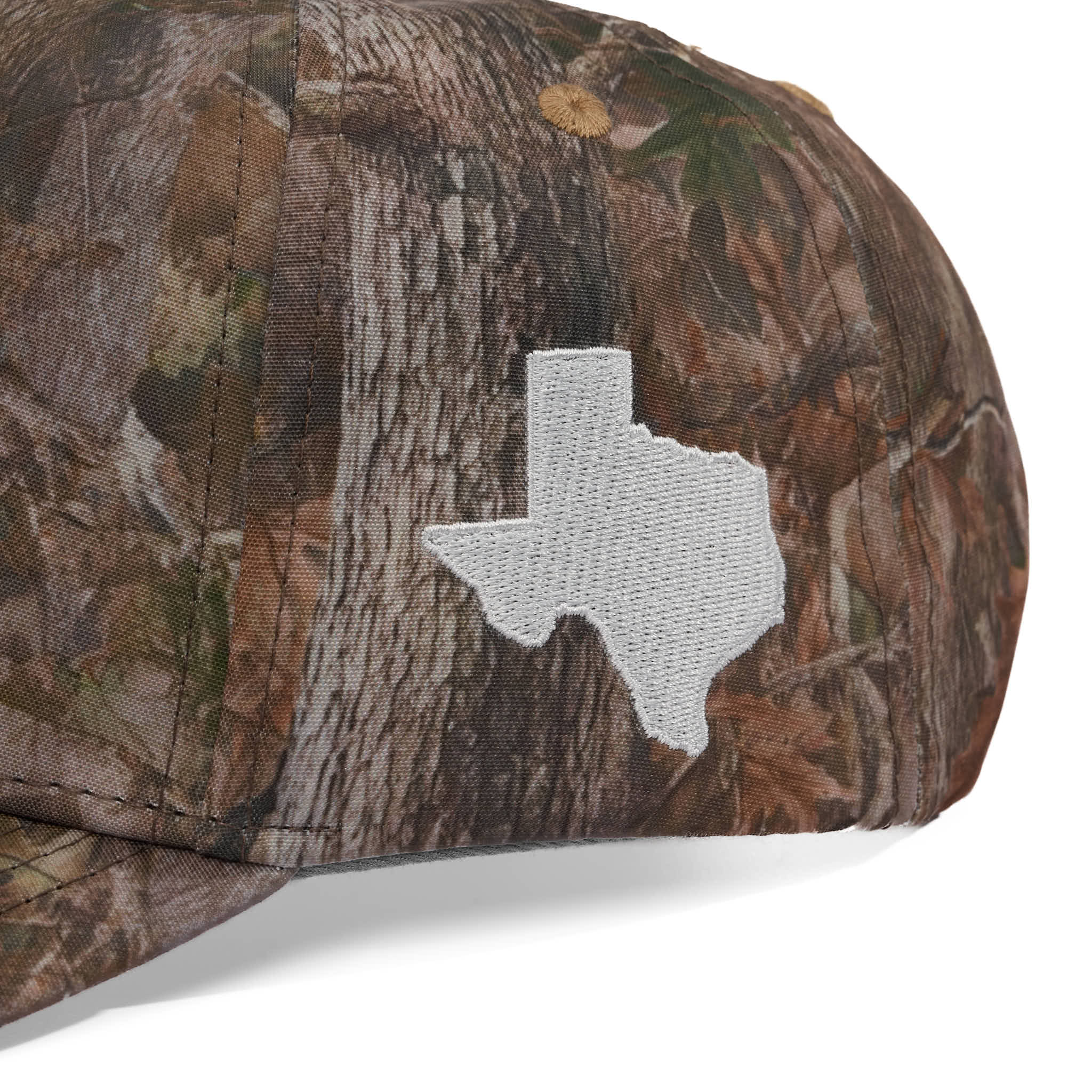 Camouflage cap with a Texas-shaped patch on a white background
