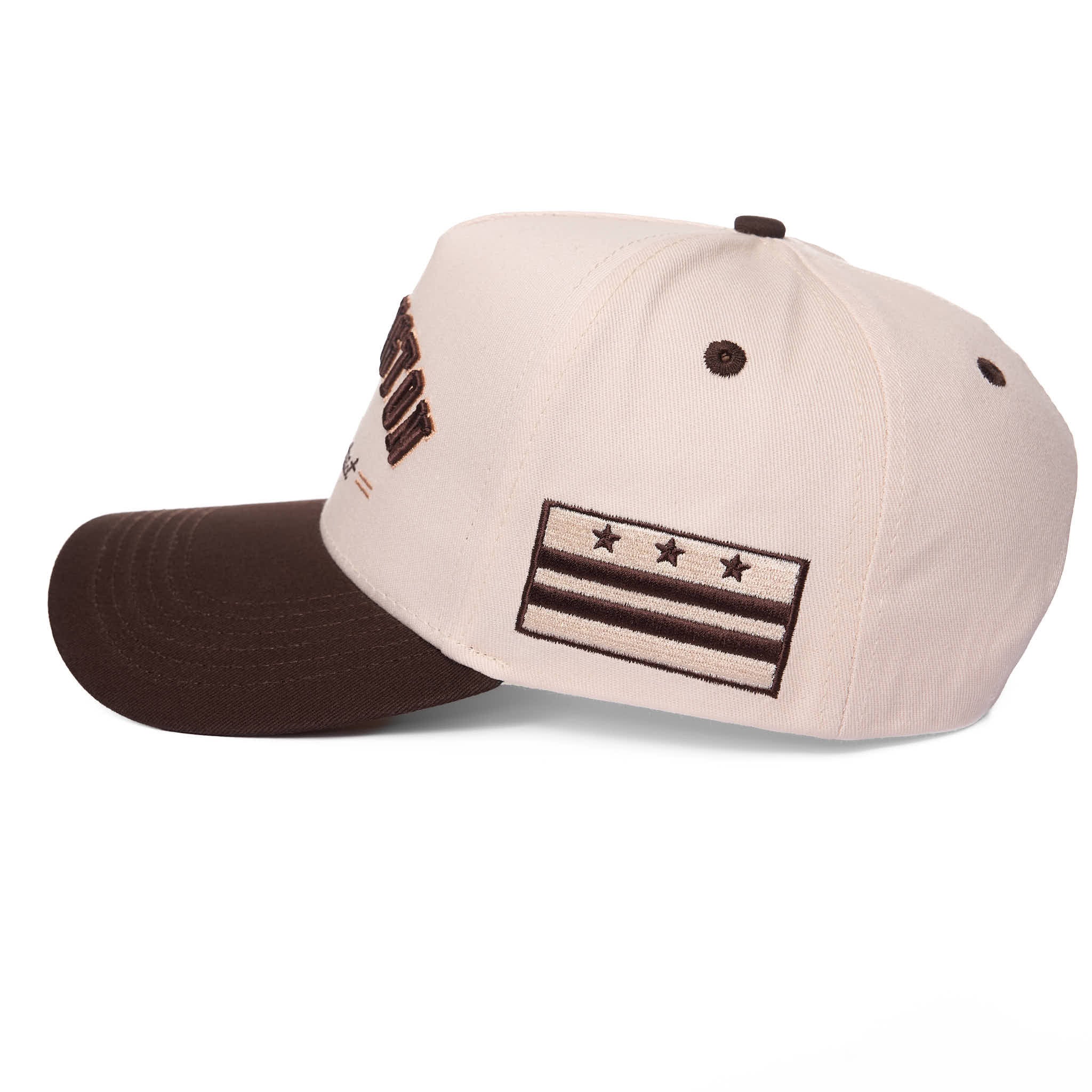 Beige and brown cap with star design on a white background