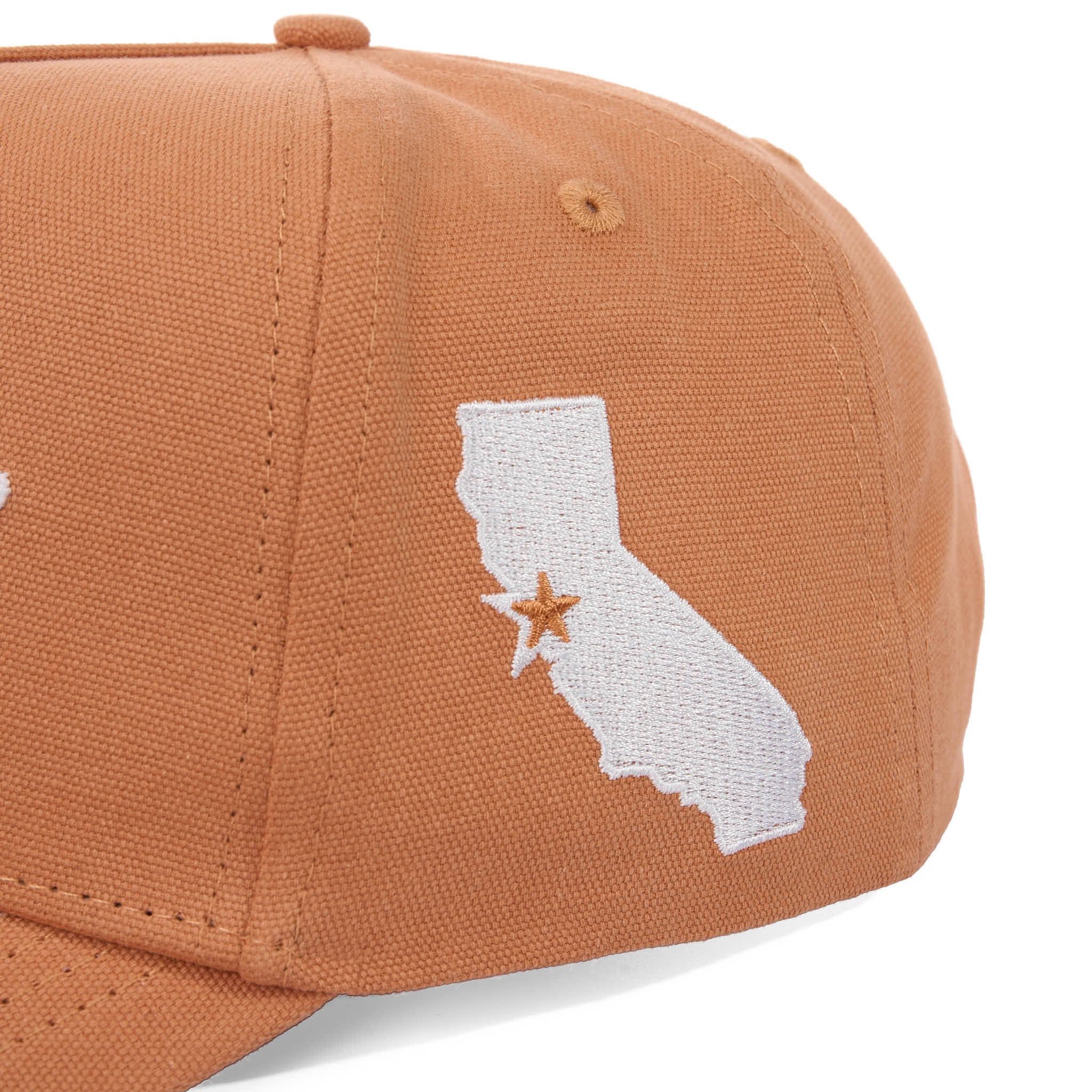 Brown cap with a white embroidered map of California and a star on a white background