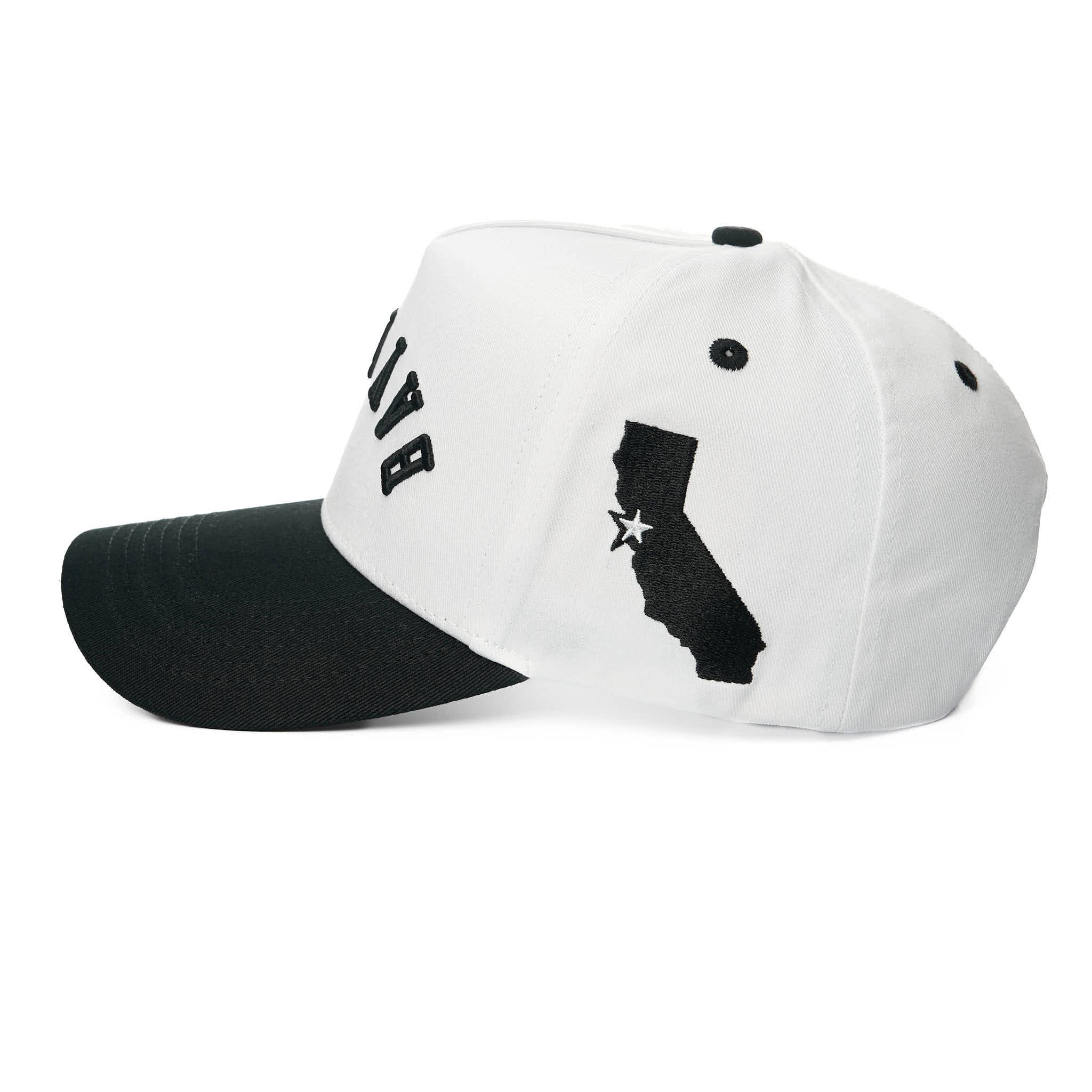 White and black cap with a state outline design on a white background