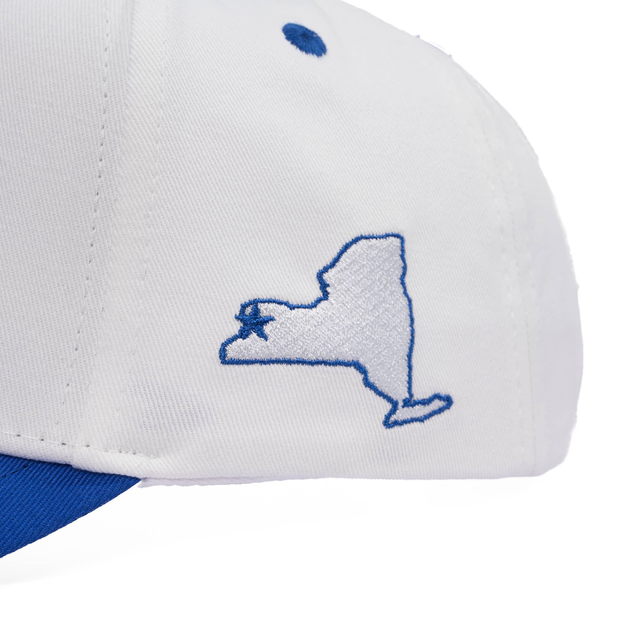 White cap with blue embroidered design on a white background