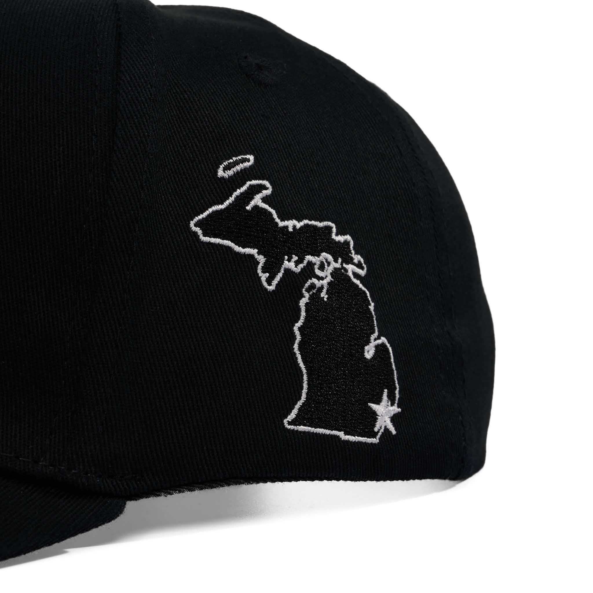 Black cap with white outline of a state design on a white background